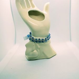 Blue and silver bracelet with a crystal clasp.